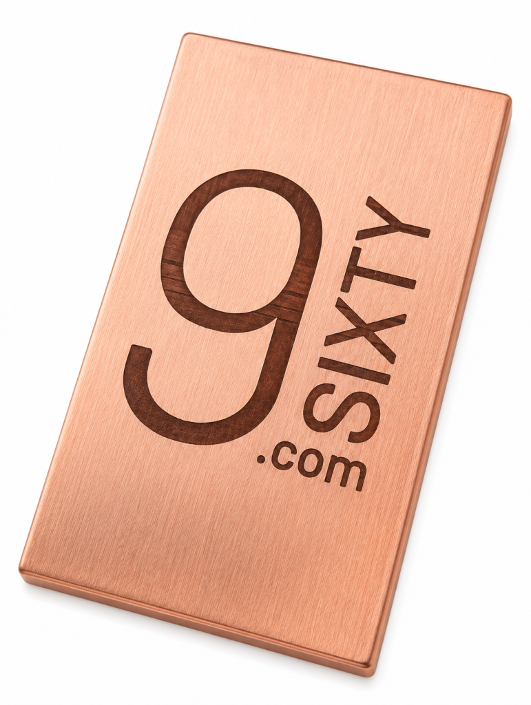 Custom company logo engraved on a solid copper bar