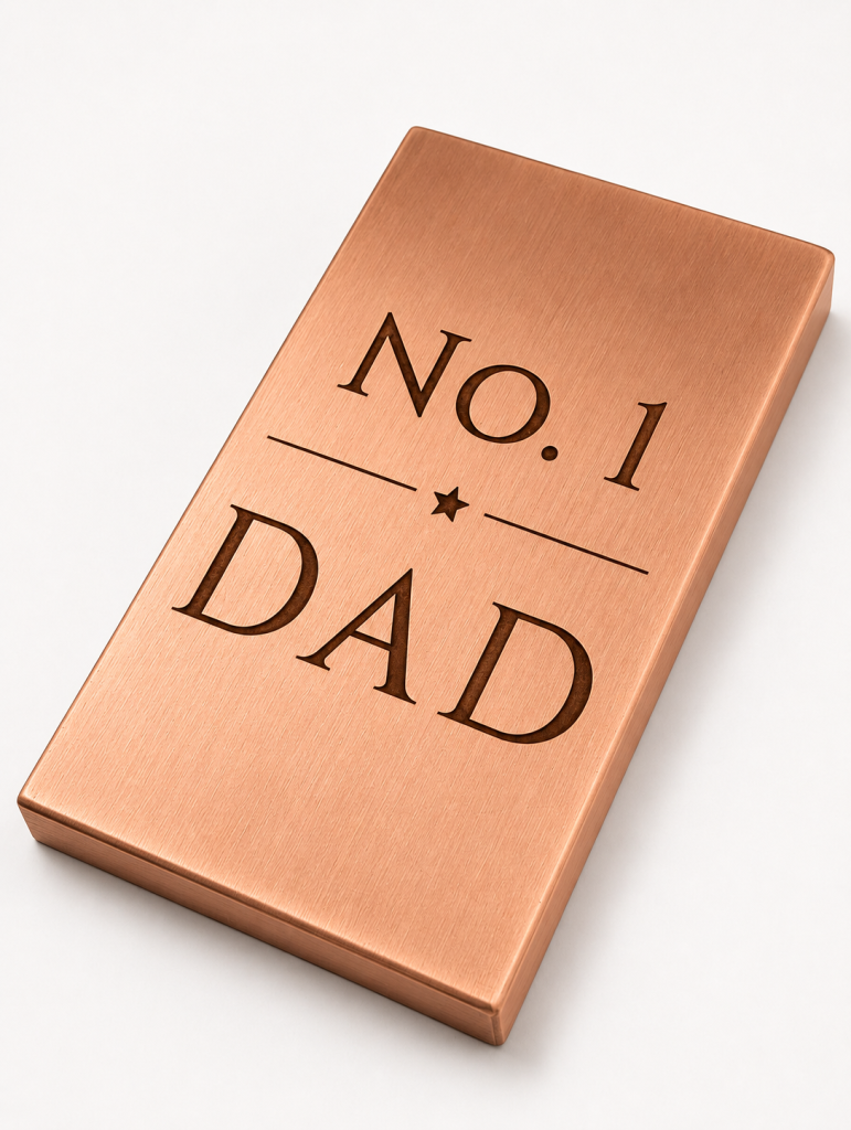 Number One Dad design engraved on a 1kg solid copper bar